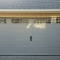 Garage door panel with windows