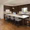 Kitchen Island Overhang with seating and cailing lighting