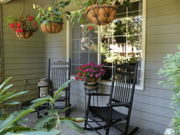 Oak black front porch rocking chairs with hanging flower pot Oak black front porch rocking chairs with hanging flower pot
