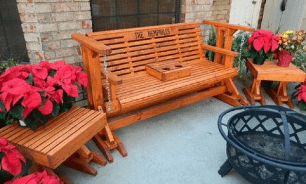 Front porch glider swing decoration with table and flower pots Front porch glider swing decoration with table and flower pots