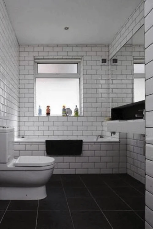 Bathroom Dark Tiles and White Walls