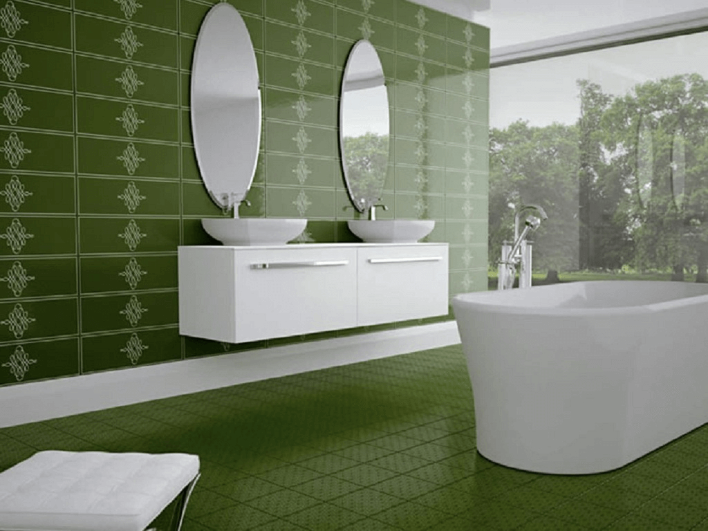 Green wall and floor tile bathroom with white bathtube and vanity sink