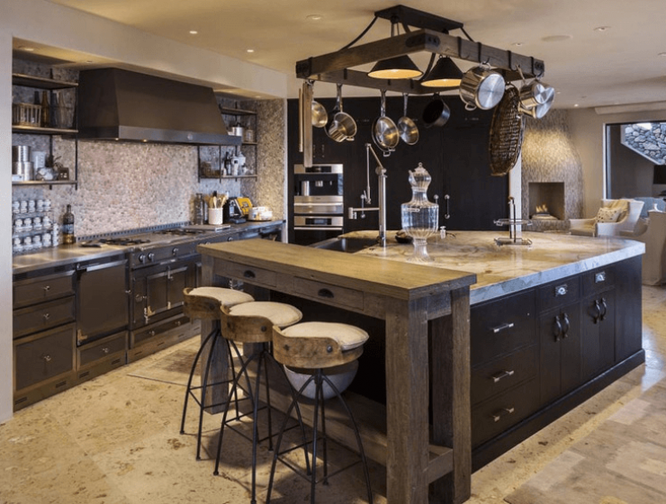Large black kitchen island with sink