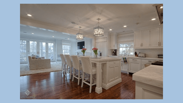 White kitchen island with cabinets on both sides