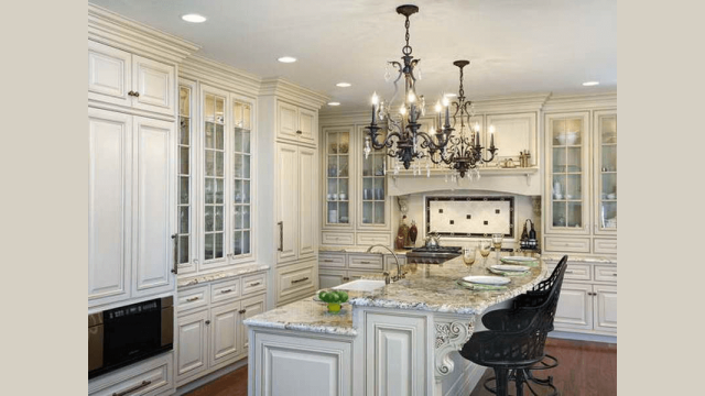 Chandeliers over kitchen islands hanging lights