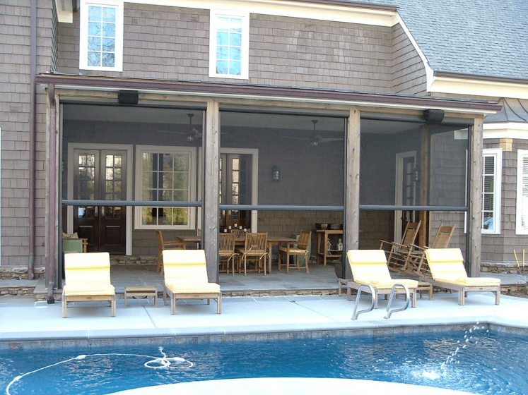 Motorized patio screen enclosures